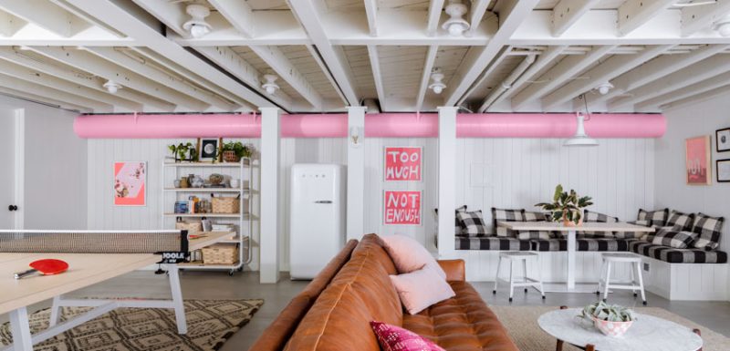 Remodeled multi-functional space with dining area, ping pong table, and stylish decor.